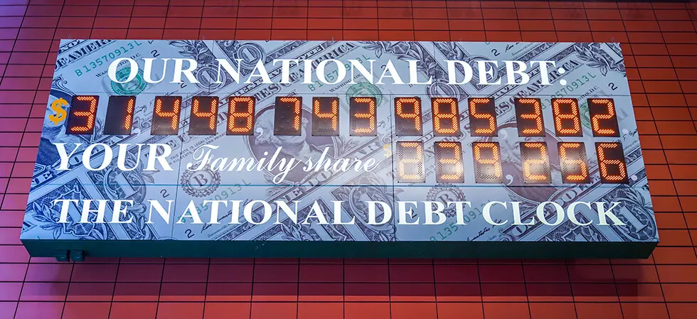 The National Debt Clock displaying the current U. S. national debt and family share figures